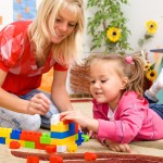 bigstock-Teacher-and-child-are-playing--26401664